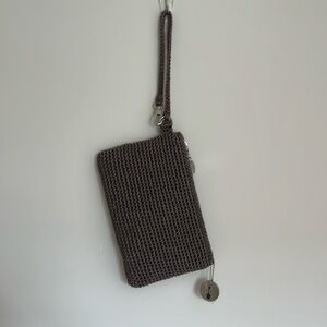 The Sak. New w/o tag except the metal still wrapped in plastic for protection